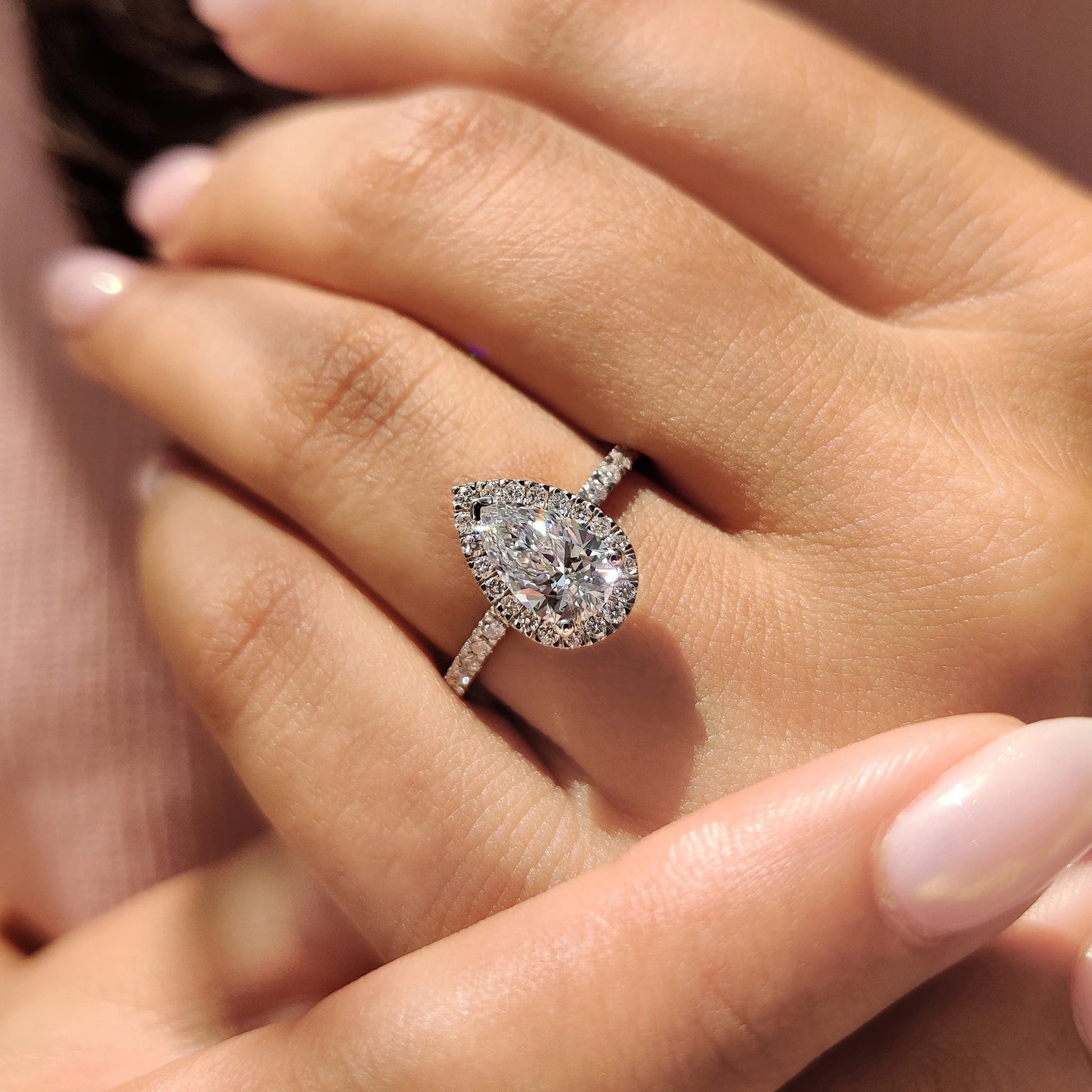 Pear Cut Engagement Ring with Hidden Halo Design