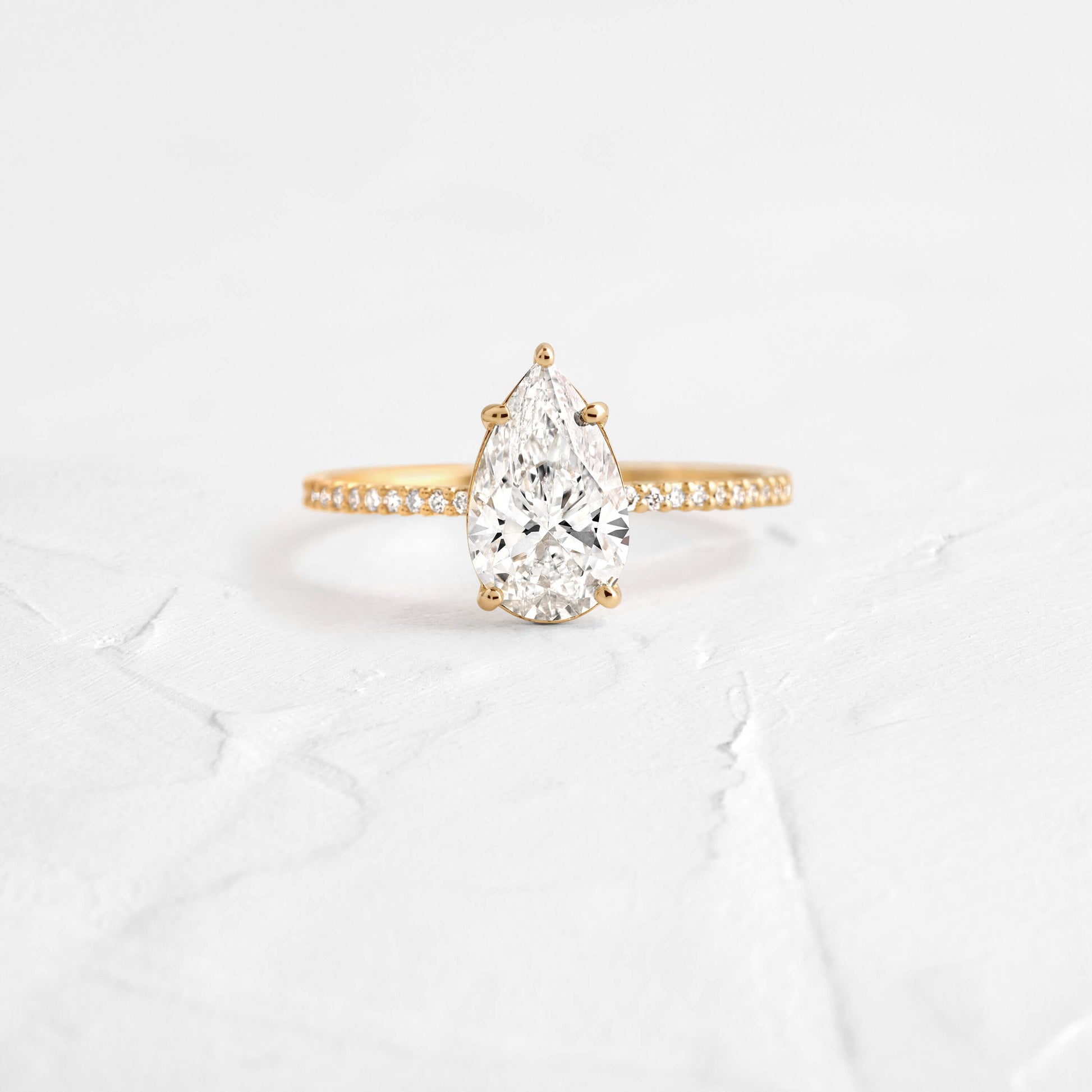 Pear Cut Engagement Ring with Hidden Halo Design