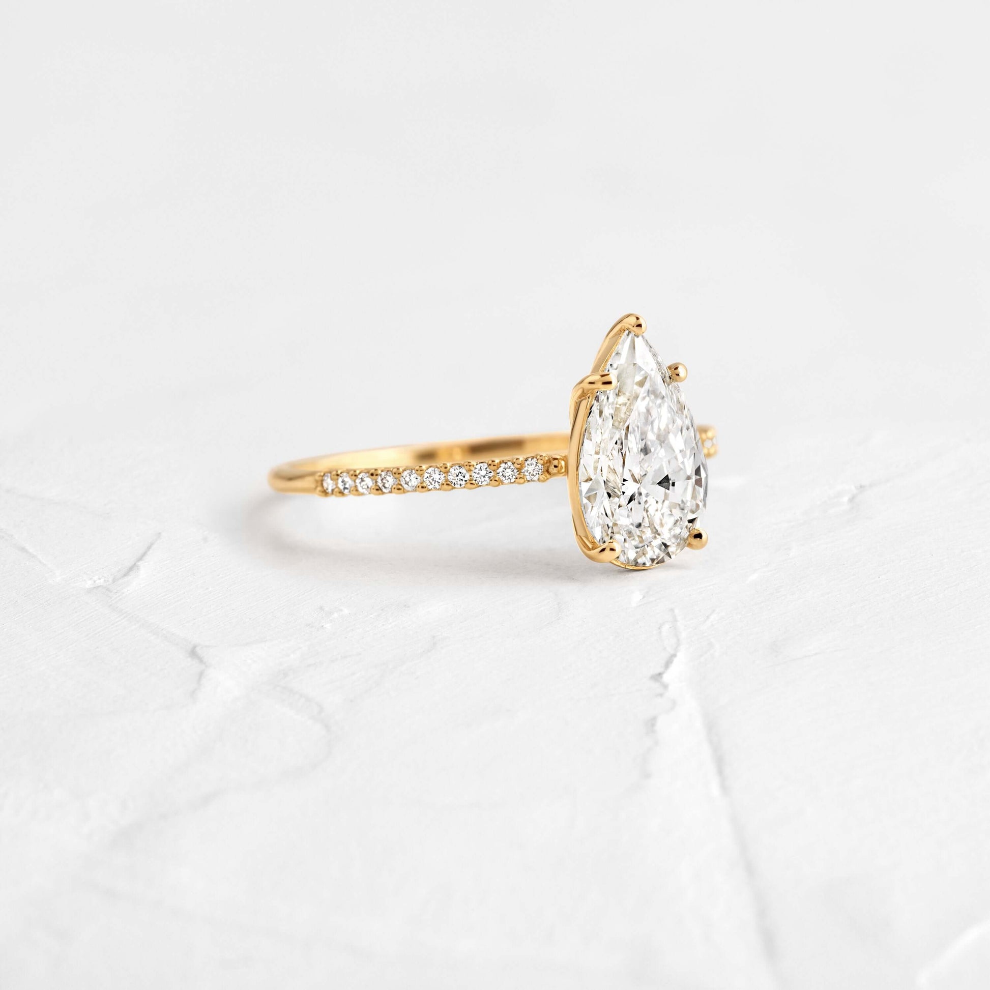 Pear Cut Engagement Ring with Hidden Halo Design