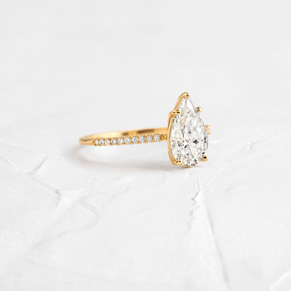 Pear Cut Engagement Ring with Hidden Halo Design
